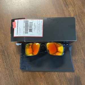 Oakley Triggerman polished black sunglasses with ruby  iridium lenses